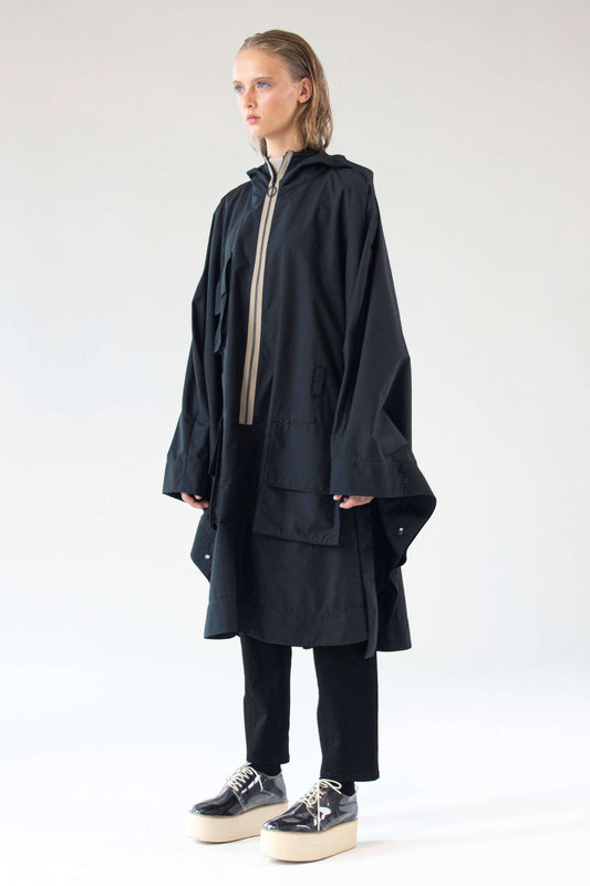 One Wolf Poncho SEEKER front view with contrast zipper and cargo pockets.