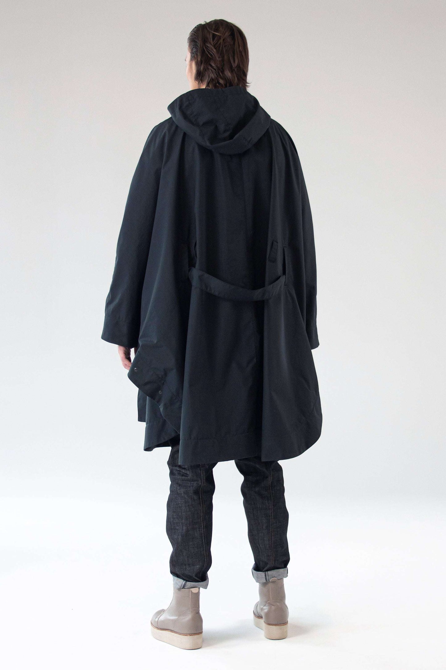 Back view of Poncho SEEKER showing hood and draped silhouette.