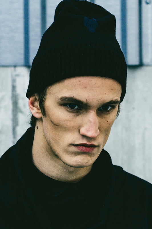 Model wearing One Wolf wool beanie, minimalist winter style