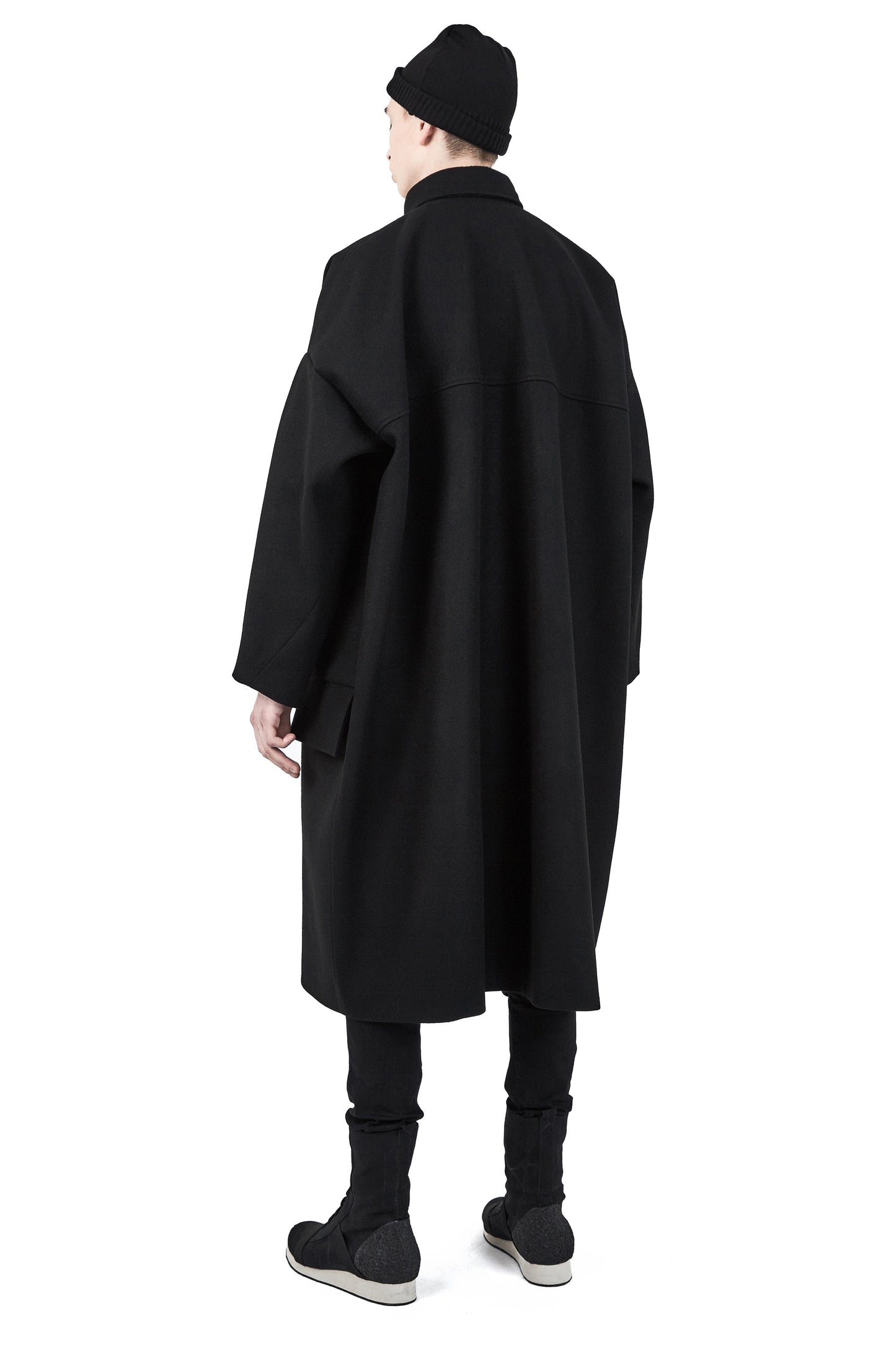 Unisex black wool beanie styled with One Wolf outerwear